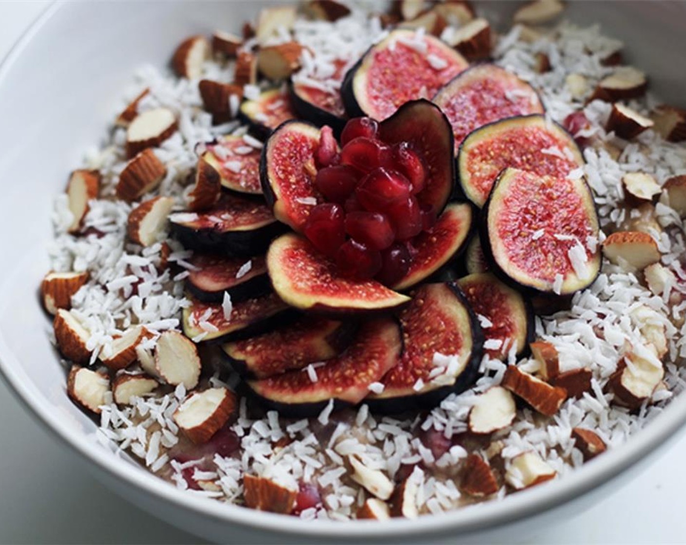 step 5 After that it’s up to you! I made my figs into a little flower pattern and scattered the Almonds (10) and Unsweetened Shaved Coconut (2 Tbsp) all around. Let your artistic soul break free on your oatmeal. Serve and enjoy!
