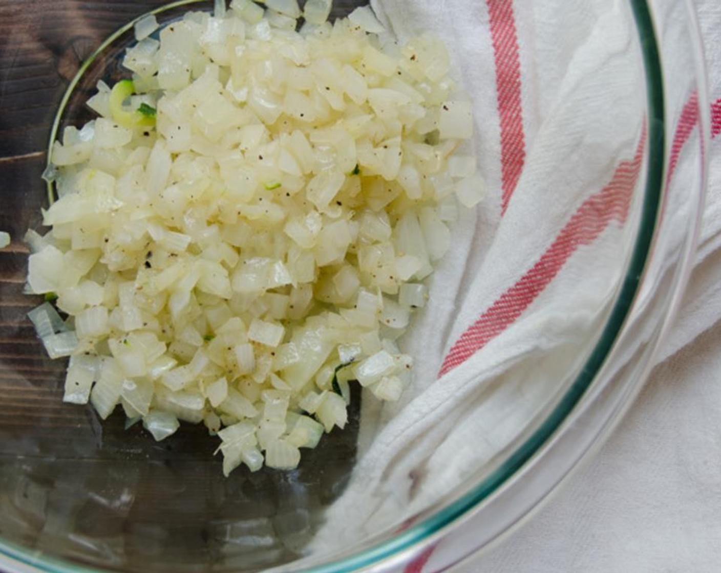 step 4 Heat Olive Oil (1 Tbsp) over medium high heat in a medium skillet. Add the onions and Salt (1 pinch) and cook until translucent. Transfer onions to a large bowl.