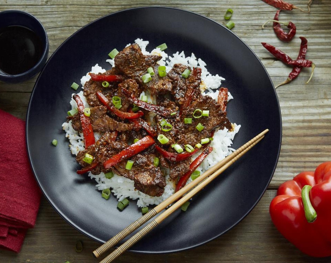 step 9 Divide the rice between two plates. Top with the Szechuan Steak and drizzle each serving with Sesame Oil (1 tsp). Garnish with the Scallion (1 bunch) and enjoy!