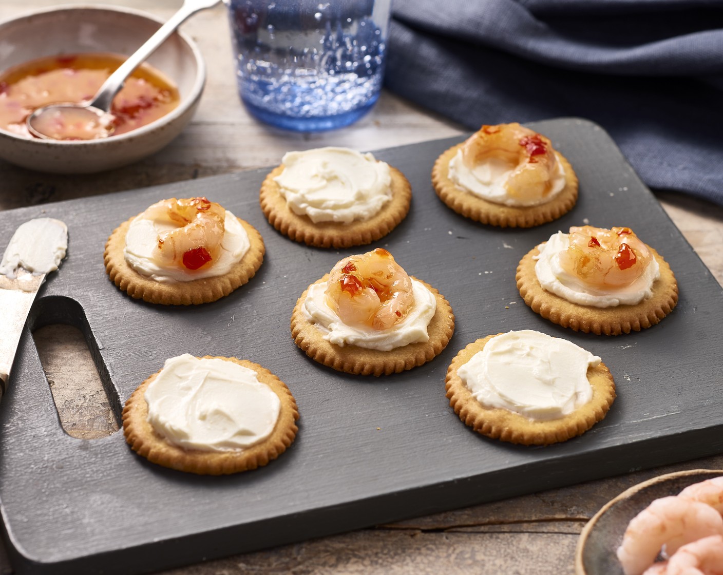 step 1 Spread approx. 1 tsp of Cream Cheese (3/4 cup) onto each Ritz® Crackers (25), then add 2-3 Prawns (10.5 oz) and a drizzle of Sweet Chili Sauce (3 Tbsp).