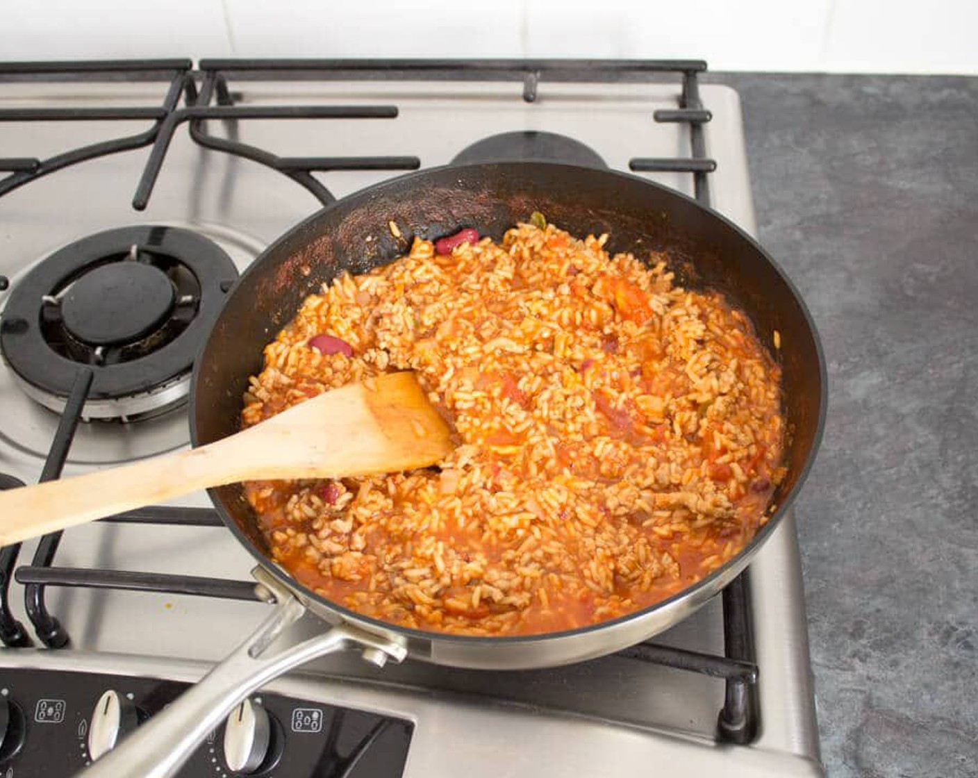 step 7 Next, empty the Ready Cooked Mexican Rice (2 2/3 cups) packets into the pan and give it a good stir. If you have frozen half, only use half the amount of rice. Allow to warm through for a few minutes.