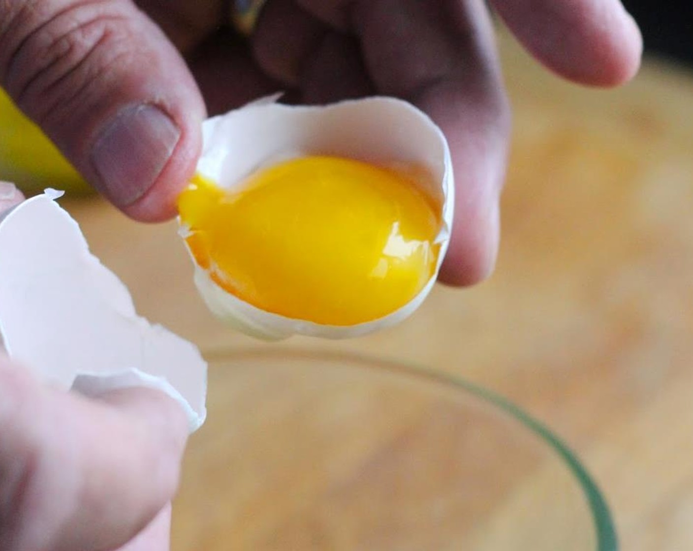 step 1 Separate 2 Eggs (2) placing egg yokes in a large measuring bowl.