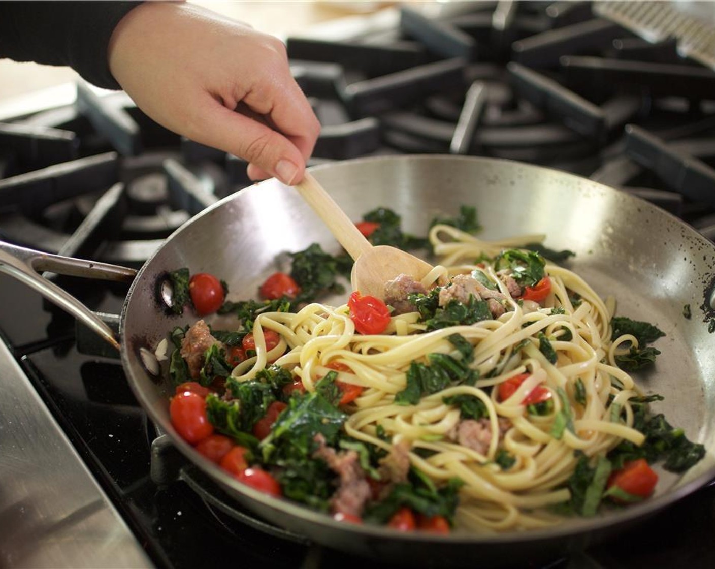 step 8 Add the linguine and toss until the pasta is well coated. Remove from heat and fold in the basil.