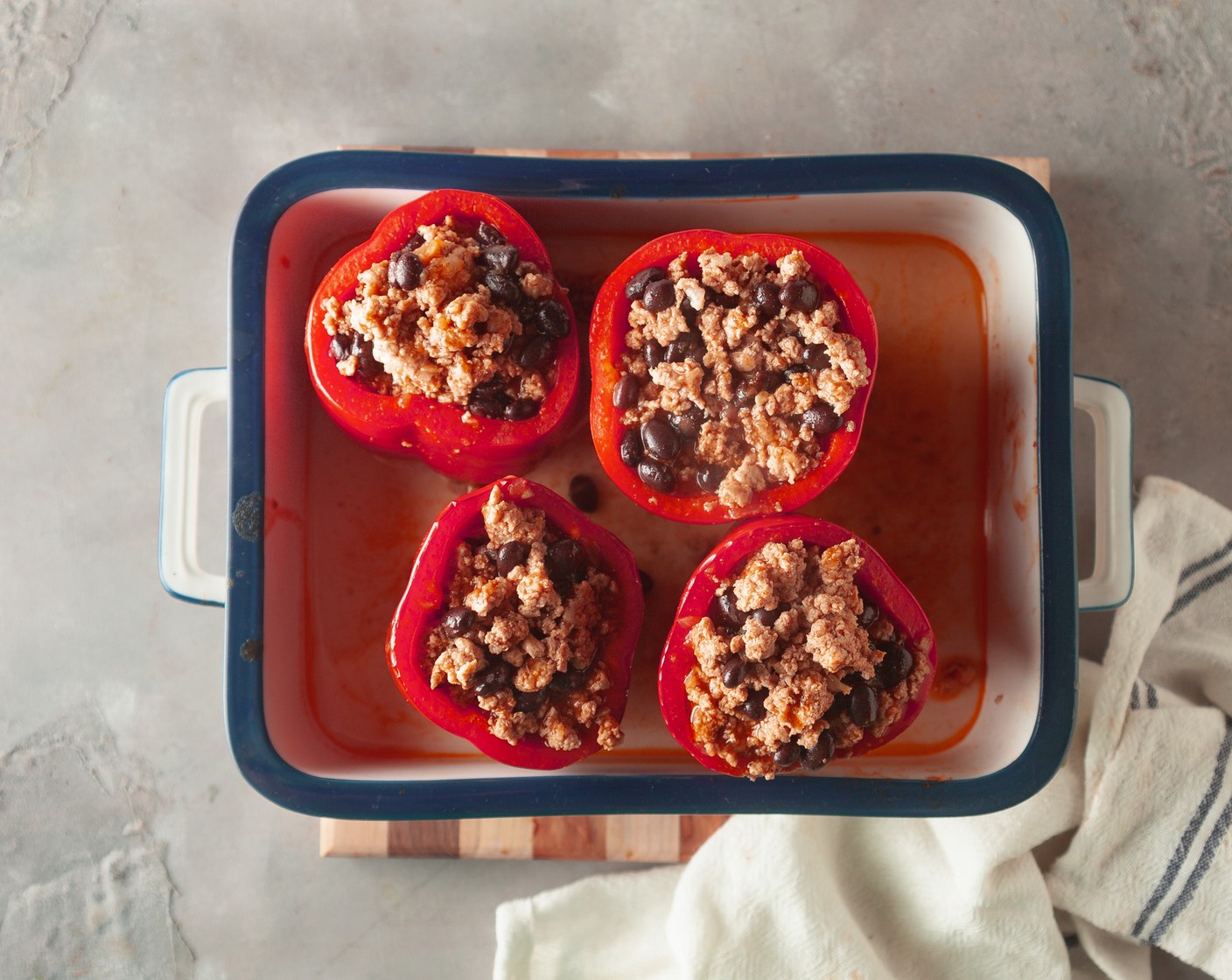 step 6 Spoon the meat mixture into the peppers. Cover with aluminum foil and bake for 30 minutes.