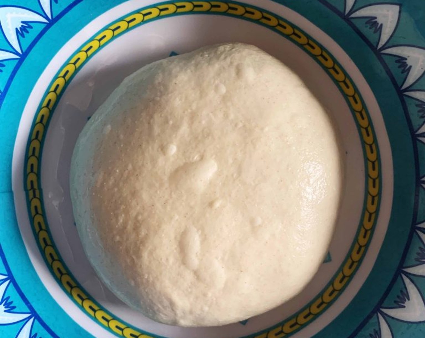 step 7 Cover with the bowl and let rest for 15 minutes. Then repeat with one more round of slap and fold. The dough now should look smooth, soft, and have some small bubbles.