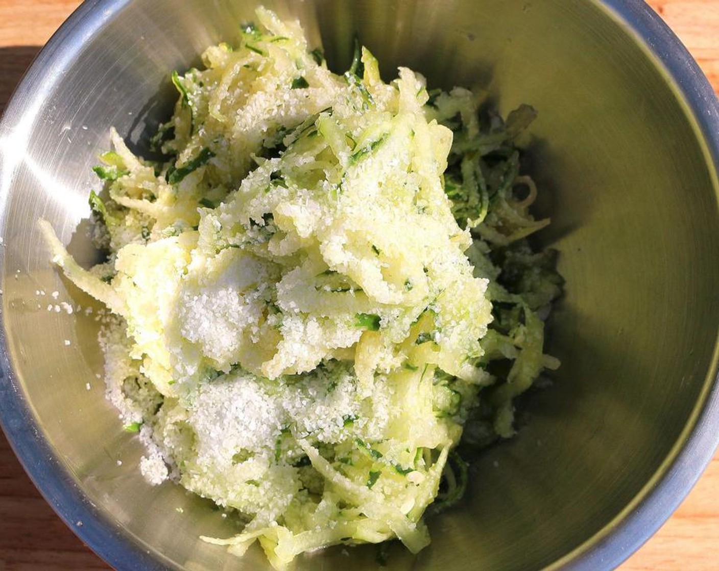 step 2 Grate cucumbers, Salt (to taste) generously, mix well, let stand for 15 minutes.