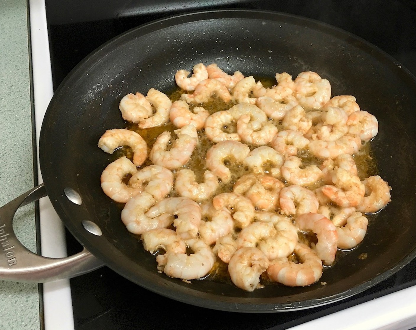 step 6 Reduce heat to low, add shrimp and sauté until almost cooked through.