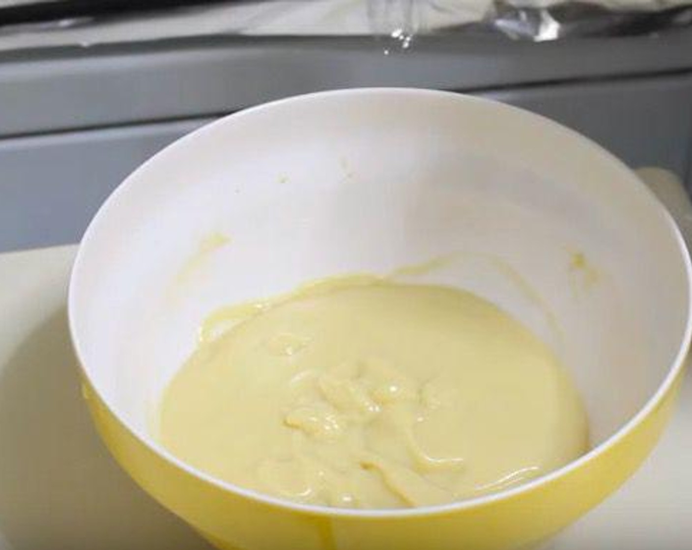 step 2 Pass custard through a strainer into another dish. Cover in plastic wrap, making sure the plastic wrap touches the custard. Store in fridge.