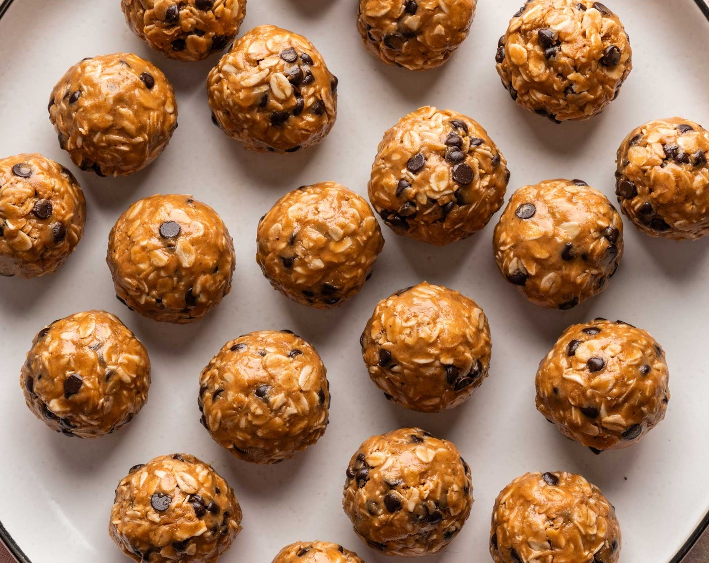 step 3 Line a baking sheet with parchment paper. Roll mixture into 1-tablespoon-sized balls and place on sheet. Refrigerate until ready to eat. Once balls have firmed up, they can be transferred to an airtight container for storage. Store in refrigerator.