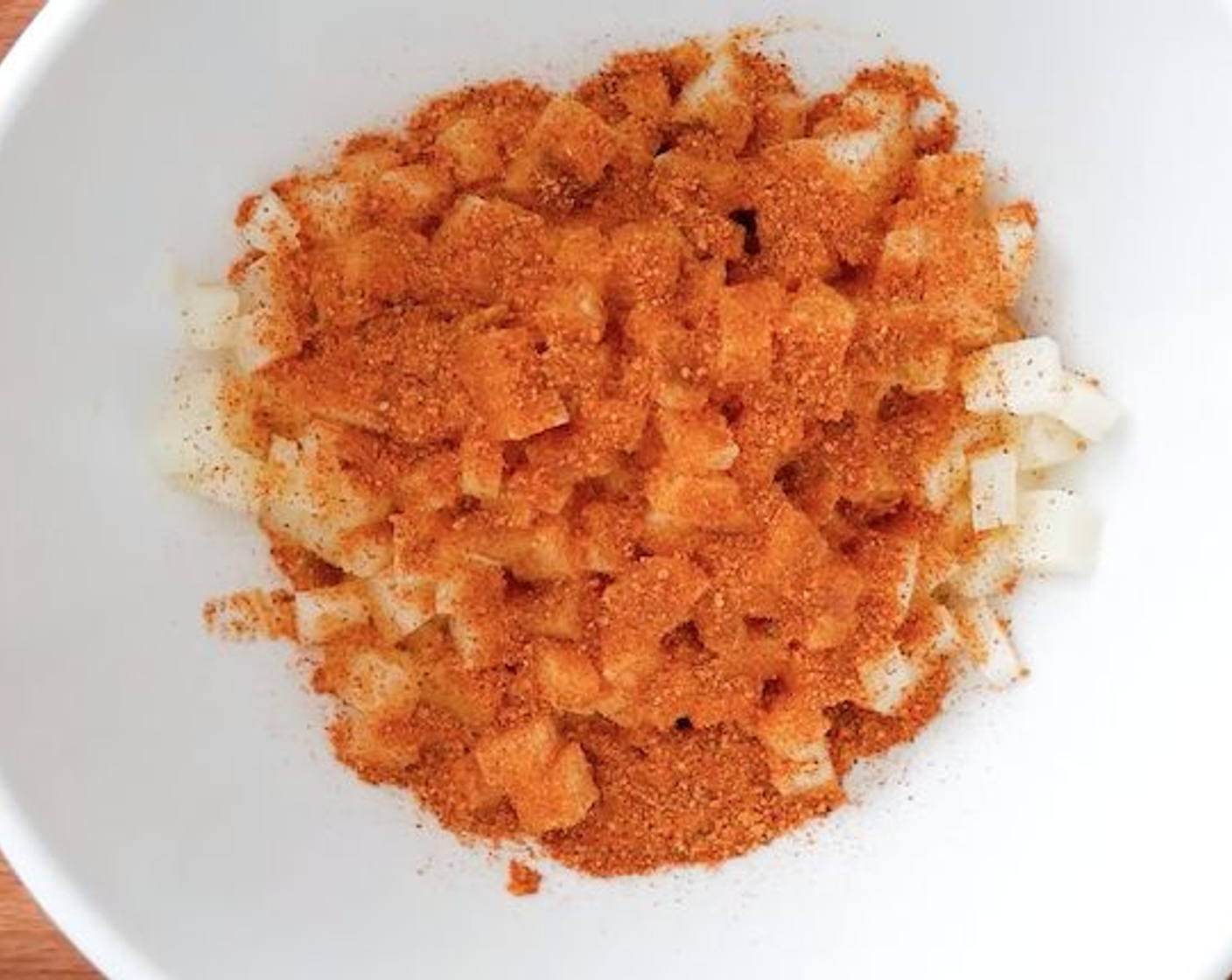 step 2 Mix potatoes with Paprika (1 Tbsp), Ground Cumin (1 tsp), Simply Organic Garlic Powder (1 tsp), Chili Powder (1 tsp), and Simply Organic Onion Powder (1 tsp) in a bowl and fill in the Empanada Dough Shells (to taste).