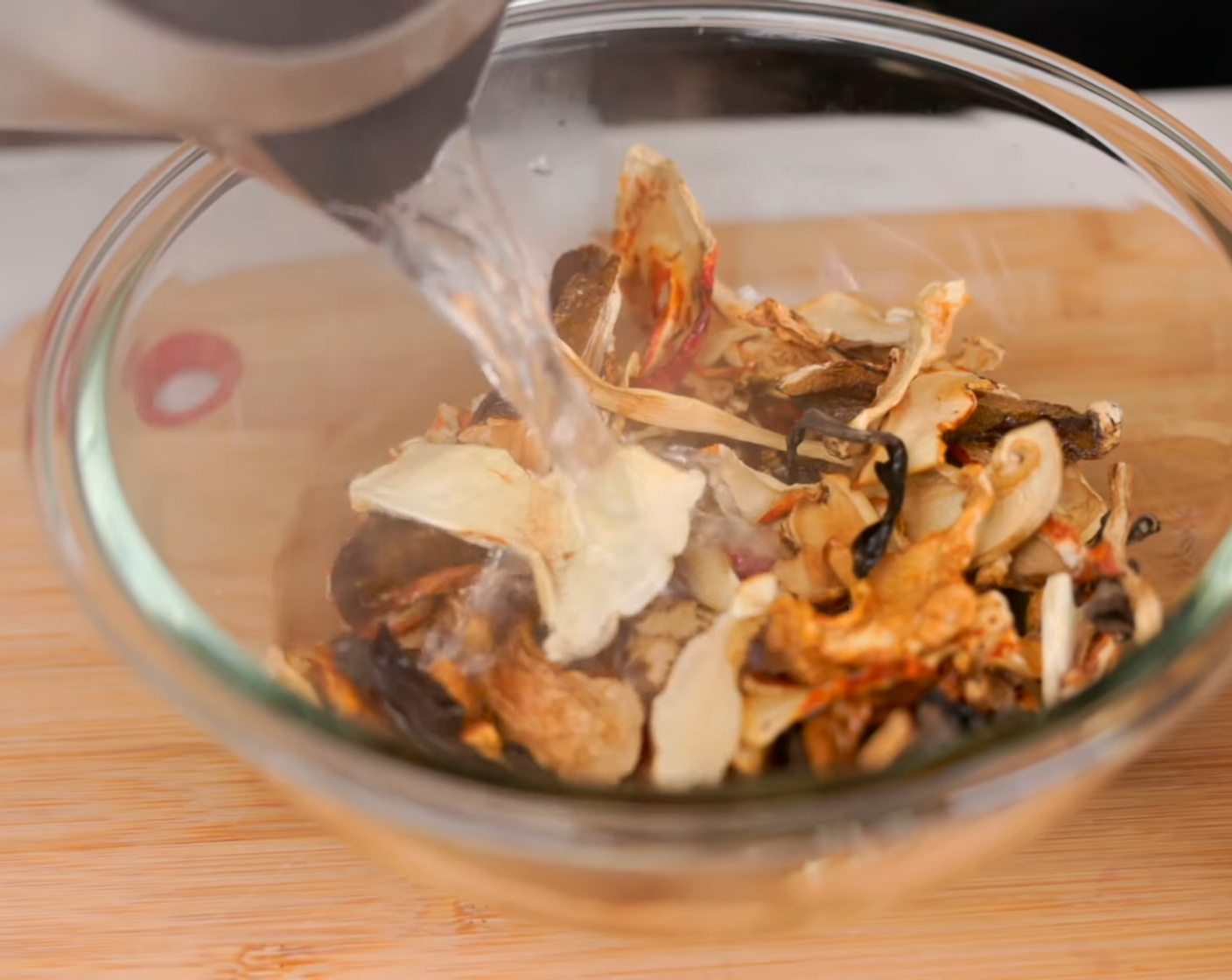 step 4 Place Dried Morel Mushrooms (1 pckg) in a bowl and pour hot water over top. Let mushrooms hydrate for 10 minutes.