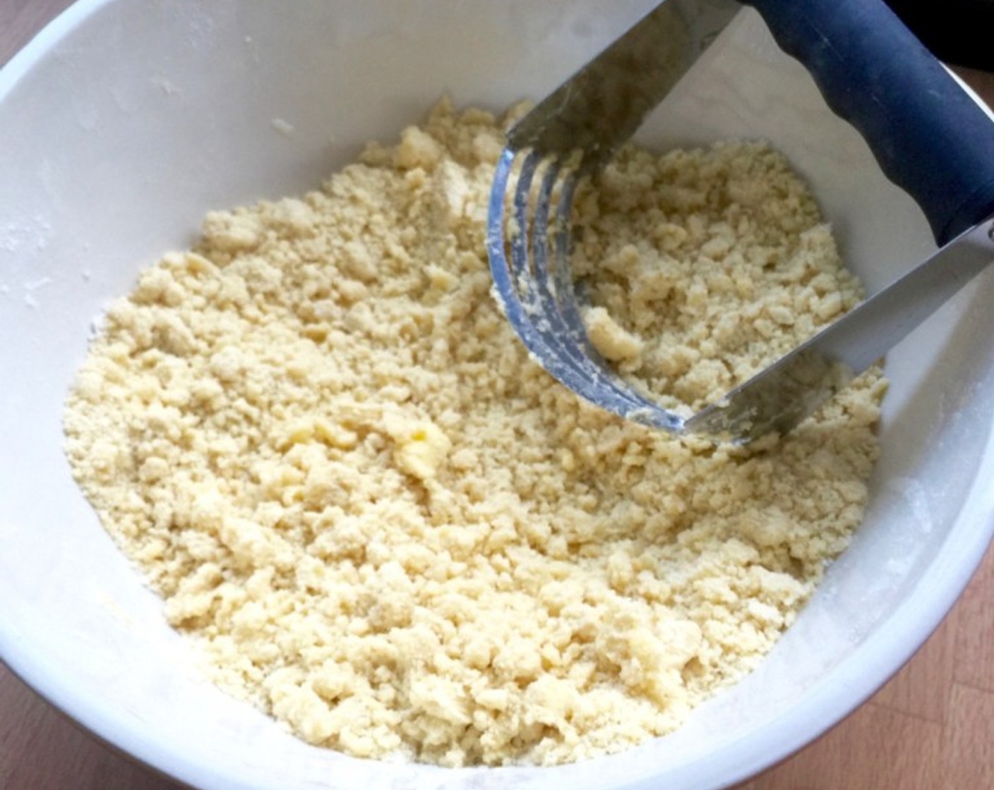 step 8 Using a pastry cutter or pointed end of a fork, cut the butter into the flour mixture until it resembles fine bread crumbs. You essentially want to coat the butter crumbs in the flour mixture.
