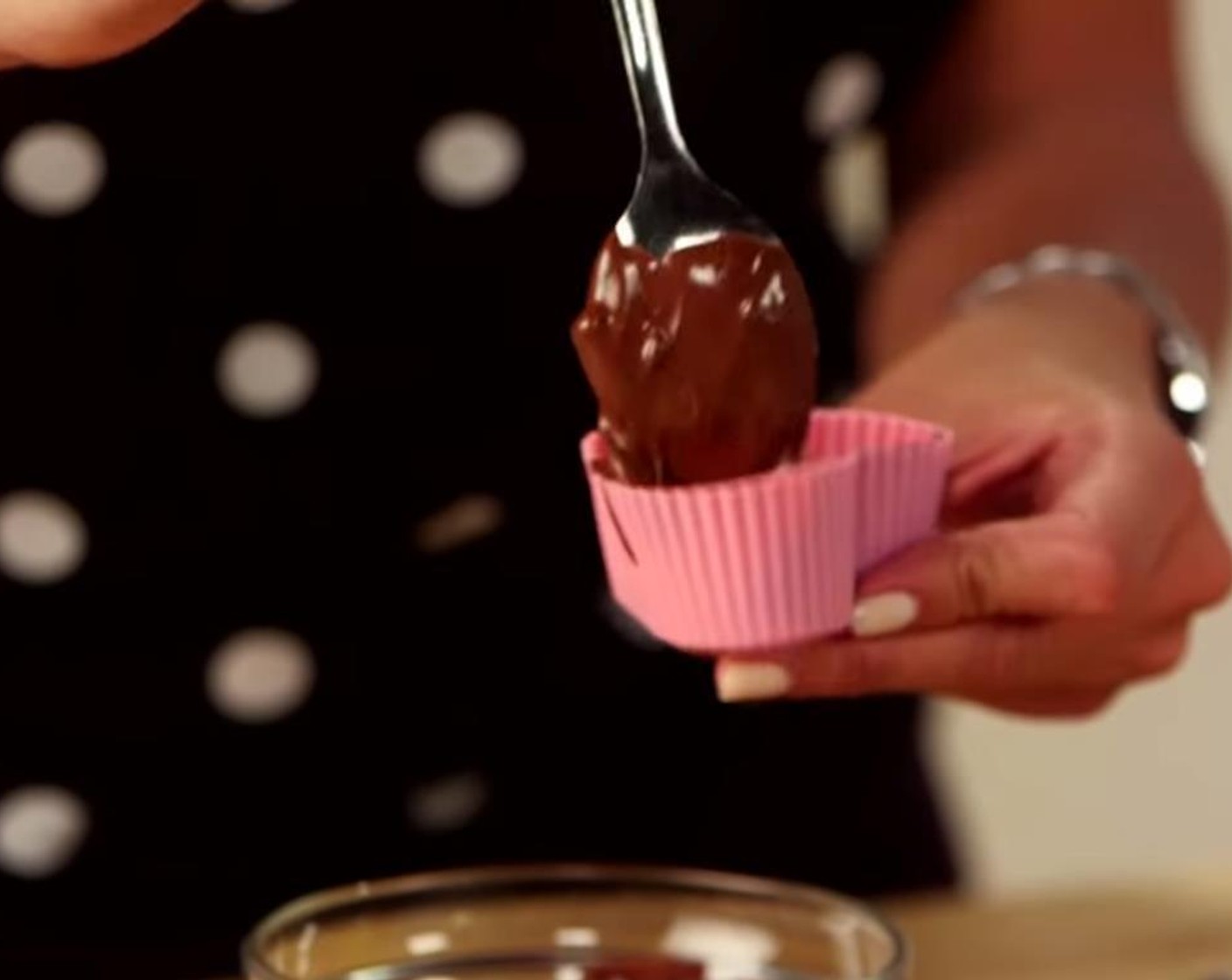 step 3 If using a silicon mold, pour melted chocolate inside so the entire molded is coated. Pour out excess chocolate.