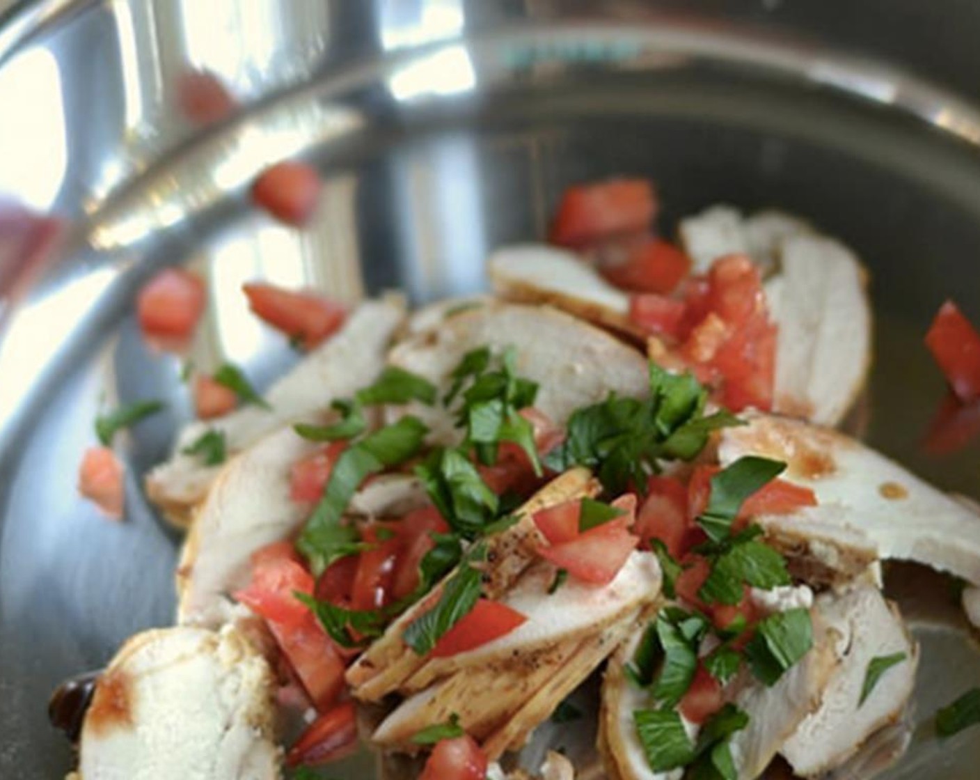step 6 Toss sliced chicken and Tomato (1) with Oil (1/2 tsp) and Pomegranate Concentrate (1/2 tsp).