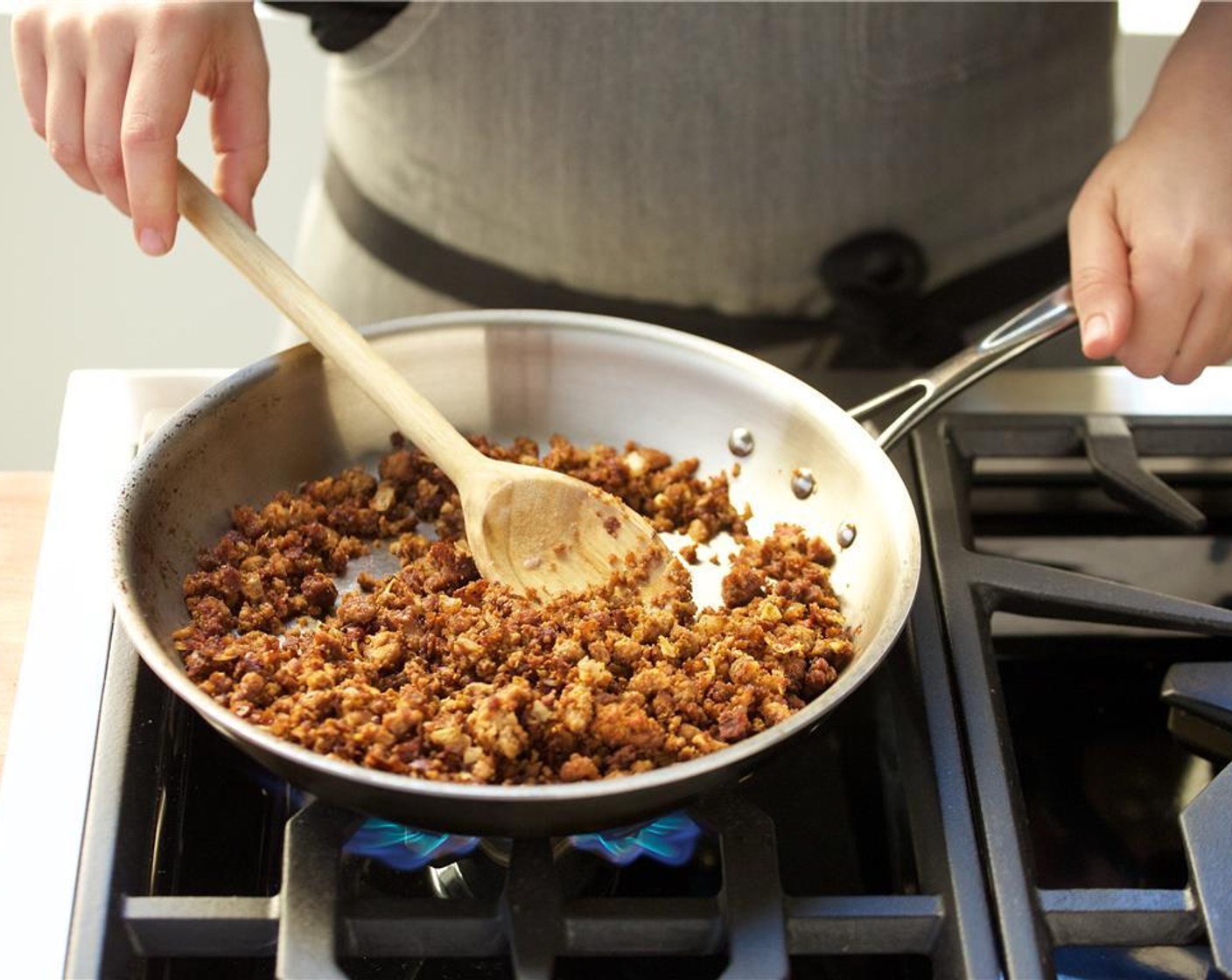 step 9 Add Tomato Paste (2 Tbsp), Vegan Beef Crumbles (1 pckg) and three tablespoons of water. Cook for an additional five minutes, stirring occasionally.