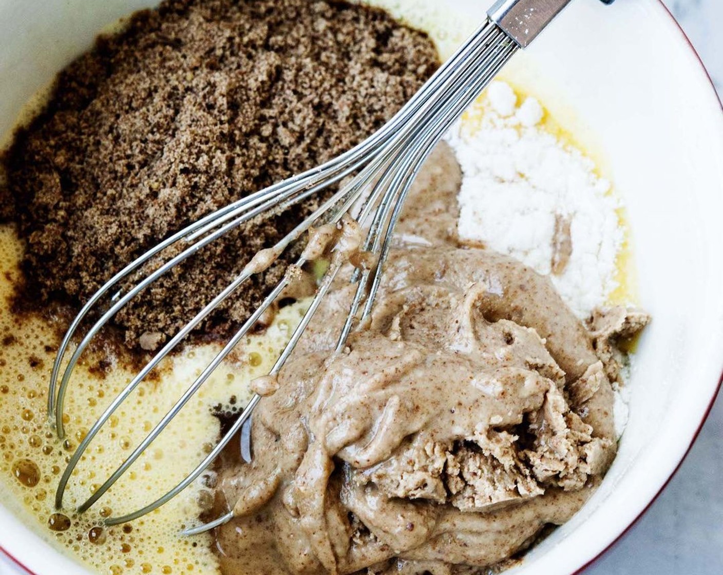 step 3 Add Baking Soda (1 tsp), Baking Powder (1 tsp), Coconut Vinegar (1 Tbsp), Coconut Flour (2 Tbsp), Flaxseed Meal (1/4 cup), Salt (1/2 tsp), Almond Butter (3/4 cup) and Honey (1 Tbsp) to the bowl with egg and mix until a thick batter forms.