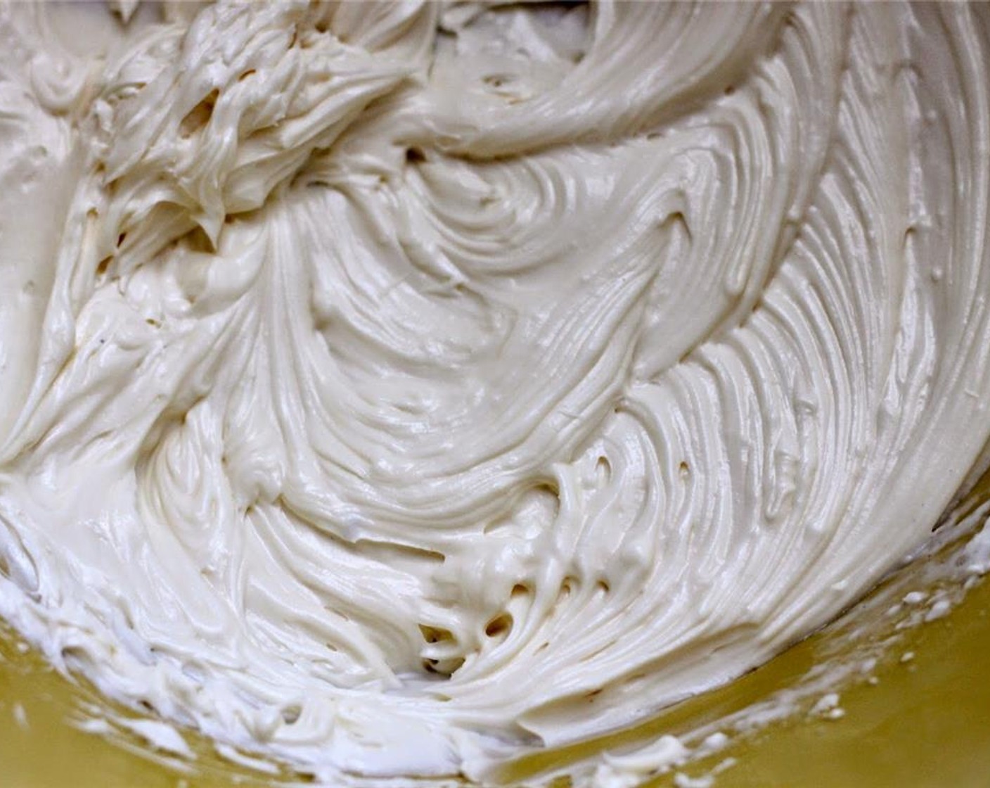step 6 In a separate bowl, combine the Cream Cheese (1 cup), Powdered Confectioners Sugar (1/2 cup), Heavy Cream (4 Tbsp), Vanilla Extract (1 tsp), and Orange Extract (1 tsp). Using an electric mixer, mix all ingredients until completely combined.