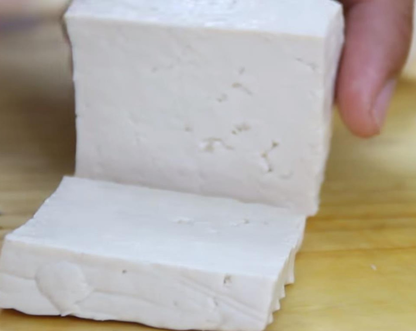 step 7 Cut the Extra Firm Tofu (12.5 oz) into 3 by 3 by 1/2-inch thick slices.