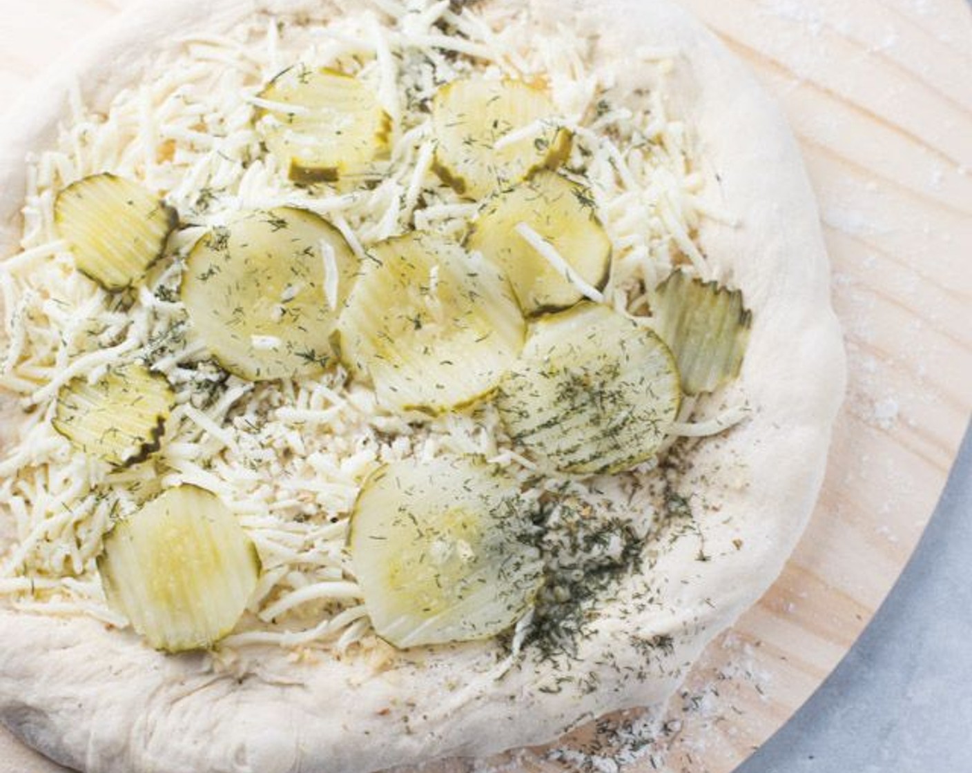 step 7 Next, top the pie with the Shredded Mozzarella Cheese (1 cup). Finally, top the pie with the Dill Pickle Coins (1/2 cup) and sprinkle on top the Dried Dill Weed (1/4 tsp).