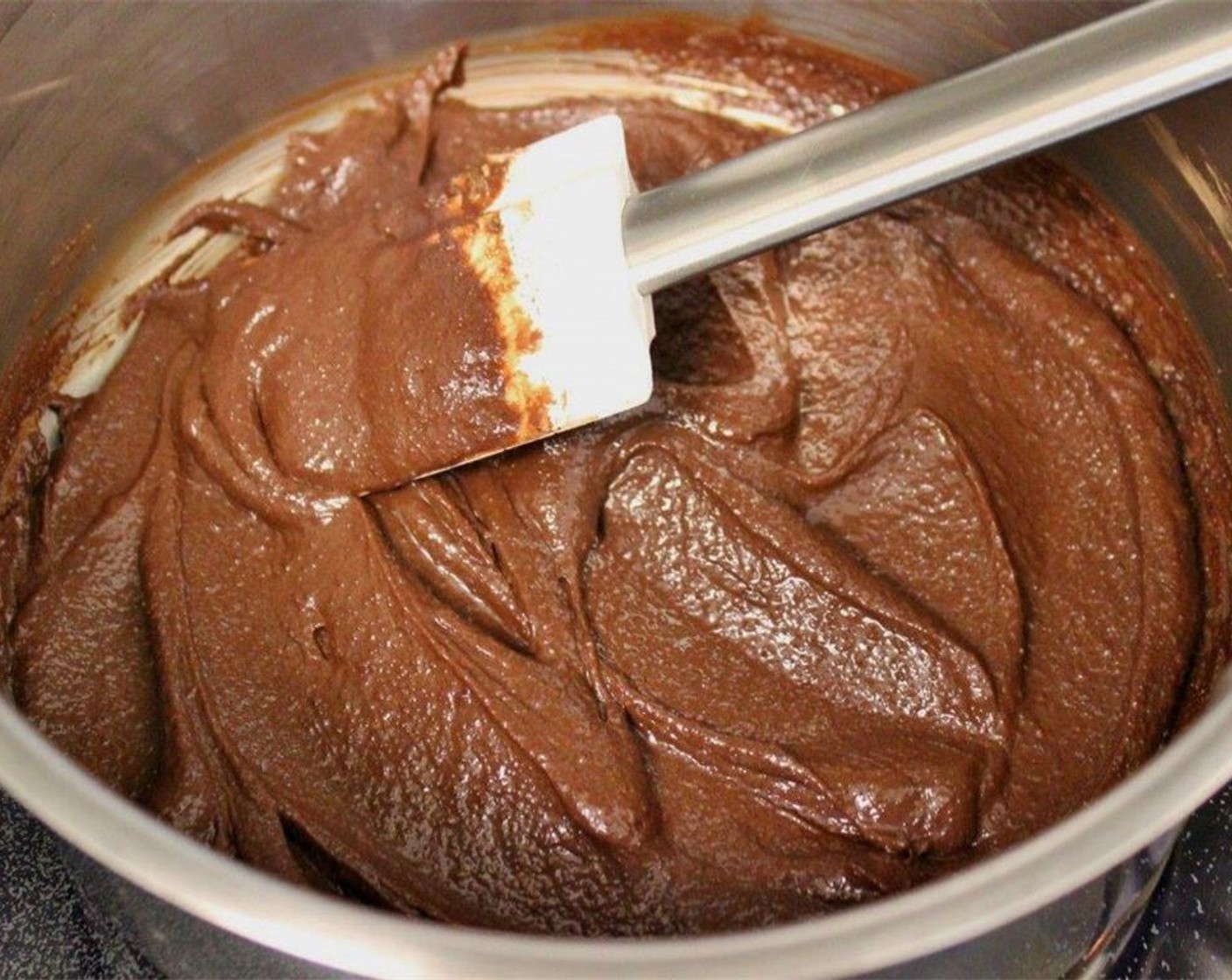 step 16 CHOCOLATE GLAZE: in a small saucepan, whisk together Unsweetened Cocoa Powder (3 Tbsp), Sour Cream (2 tubs), and Granulated Sugar (1/3 cup) while they are still cold.