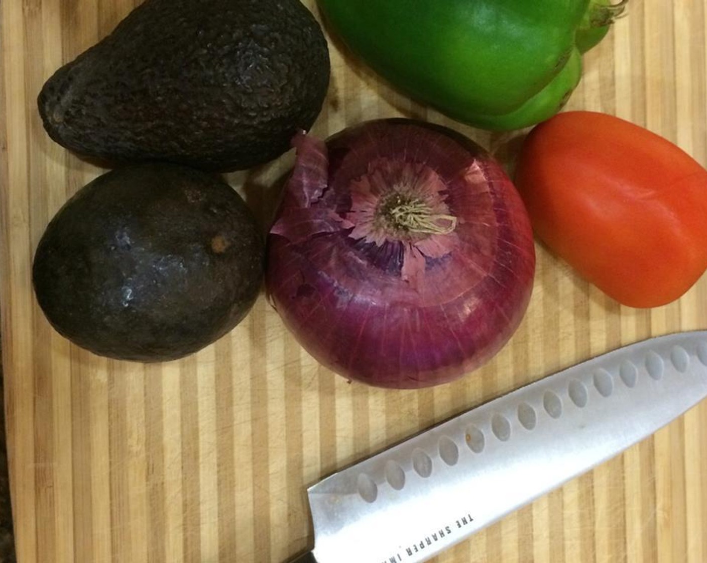 step 1 Dice the Red Onion (1/4), Green Bell Pepper (1/2) and Roma Tomato (1). Peel and pit the Avocados (2).