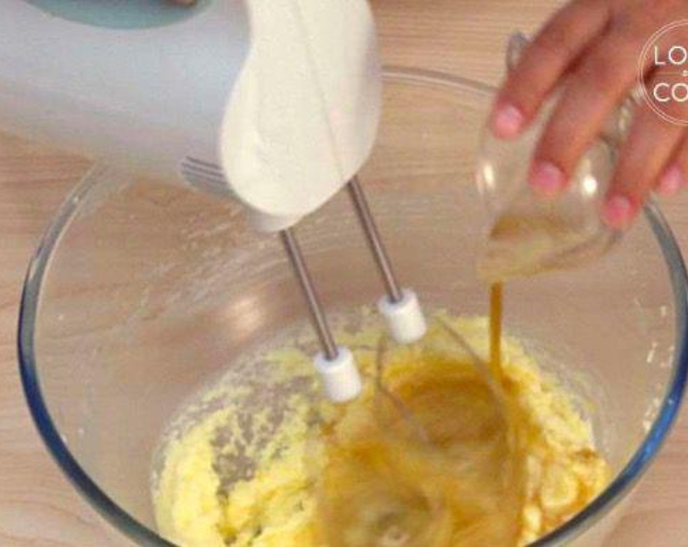 step 4 Add the egg and vanilla mixture into the butter mixture. Mix well.