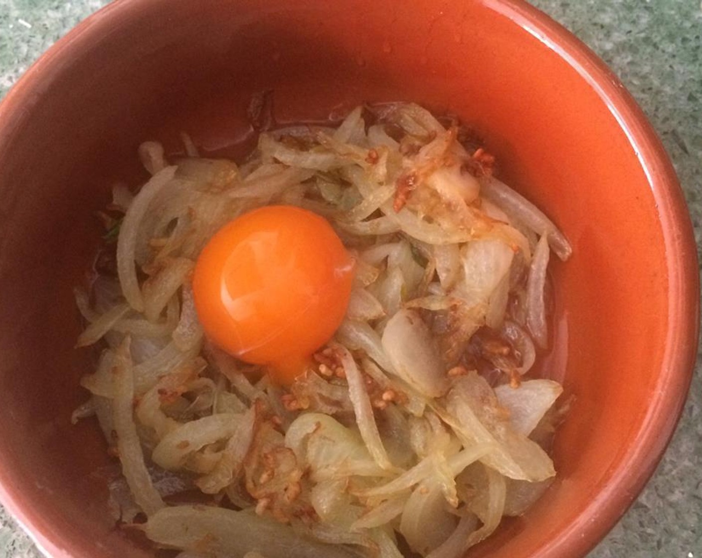 step 3 When the onion and the garlic are done, put them in a earthen bowl. Add the Egg (1).