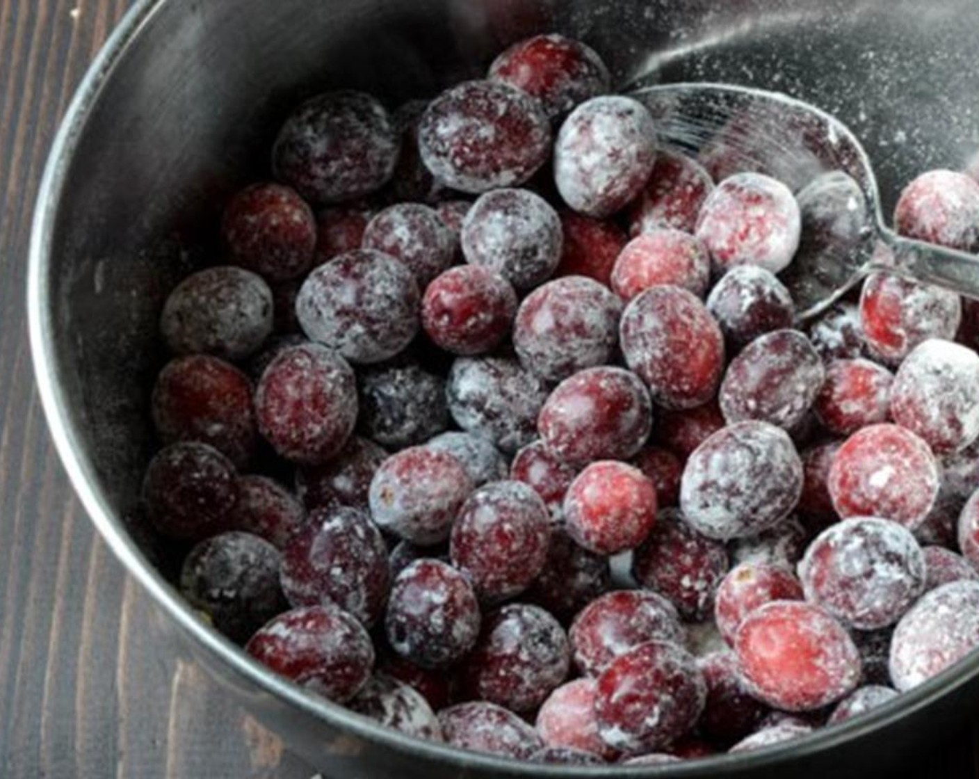 step 8 In the small bowl that contained the flour mixture, add the Fresh Cranberries (1 2/3 cups) and sprinkle with the remaining All-Purpose Flour (1/2 Tbsp). Toss to coat.