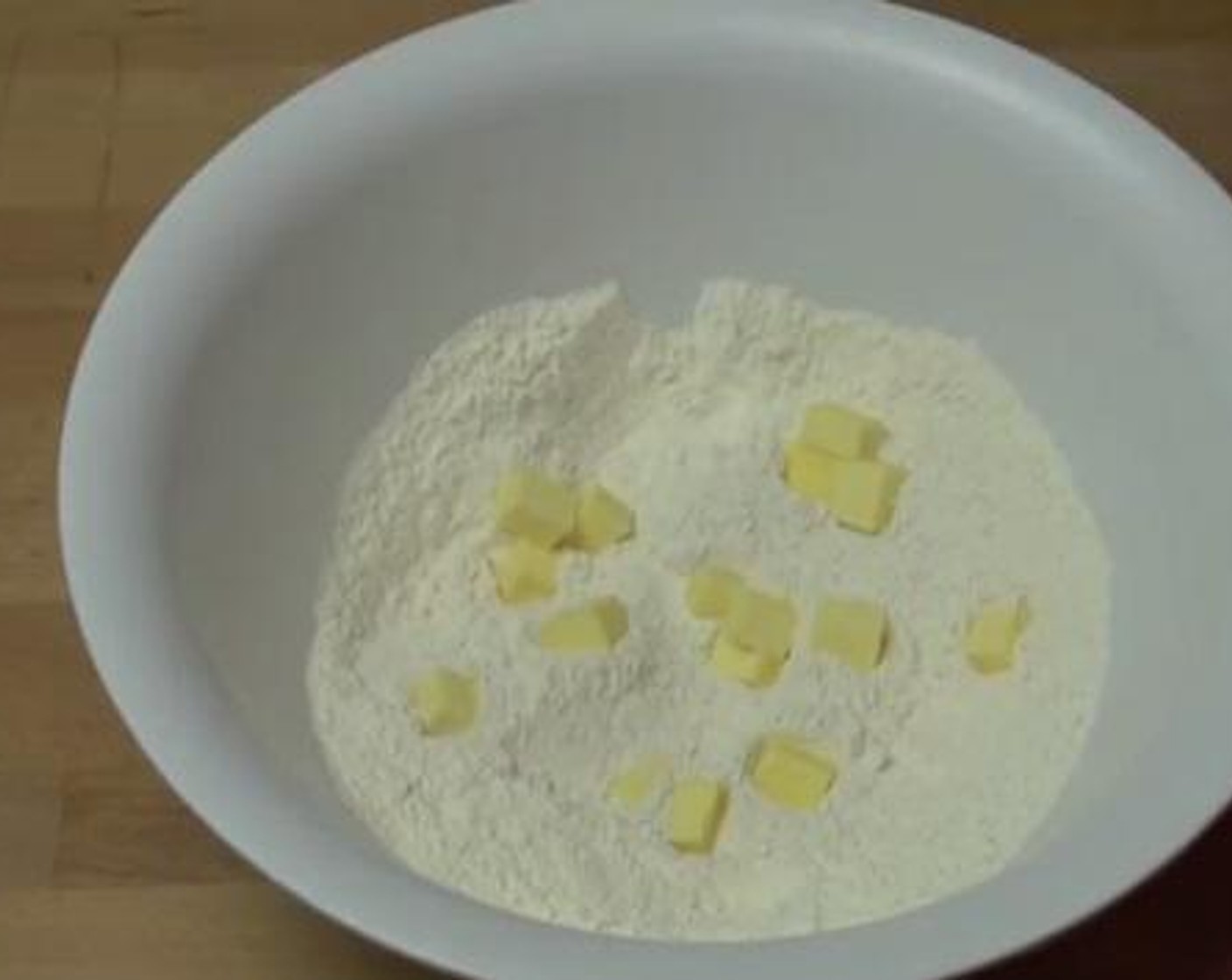 step 1 Inside a bowl, mix together the Self-Rising Flour (3 cups), Salt (1 tsp), McCormick® Garlic Powder (1/2 Tbsp), and Freshly Ground Black Pepper (to taste). Add the Butter (3 Tbsp) and rub together with the flour to combine.