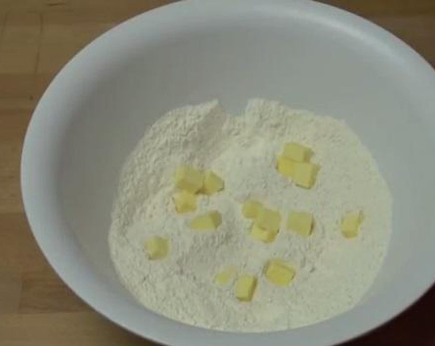 step 1 Inside a bowl, mix together the Self-Rising Flour (3 cups), Salt (1 tsp), Simply Organic Garlic Powder (1 tsp), and Freshly Ground Black Pepper (to taste). Add the Butter (2 oz) and rub together with the flour to combine.