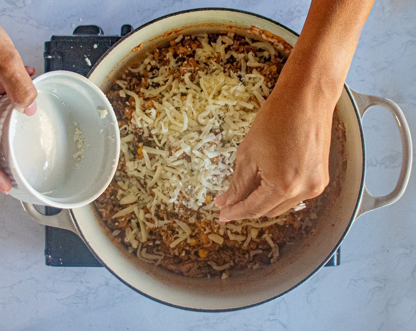 step 8 After 20-25 minutes, add the Scallions (4 Tbsp) and Shredded Mozzarella Cheese (1 pckg). Stir in well.