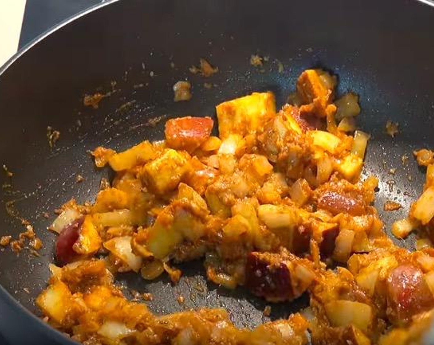 step 2 Add Garlic (2 cloves) and Curry Paste (1/4 cup). Stir for 2-3 minutes. Season with Salt (to taste) and Ground Black Pepper (to taste).