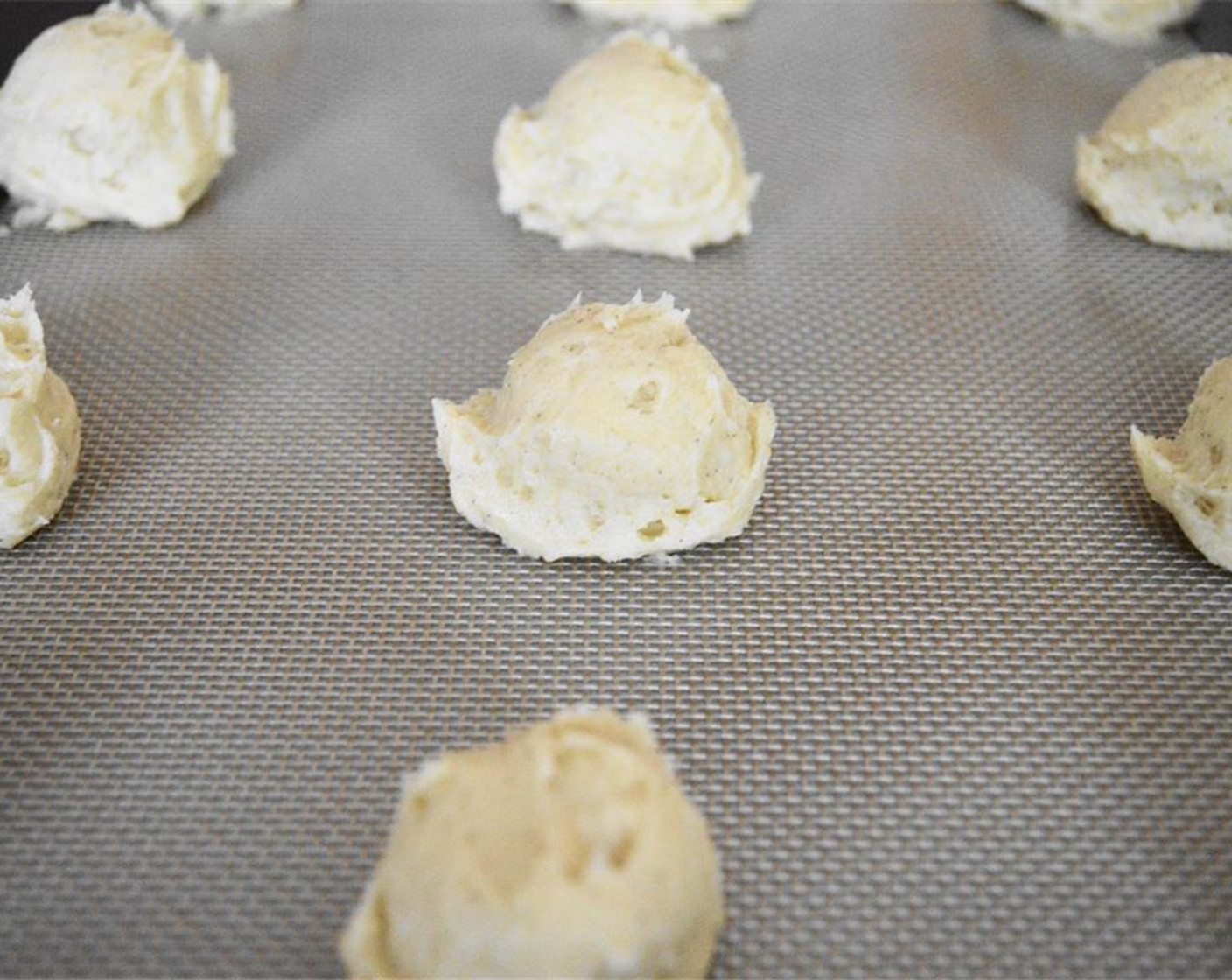 step 6 Use a 1.5 inch cookie scoop to scoop perfect little dollops of the dough onto the prepared baking sheets. Bake two trays at a time for about 15 minutes each batch. Rotate the sheets halfway through to make sure they bake evenly.