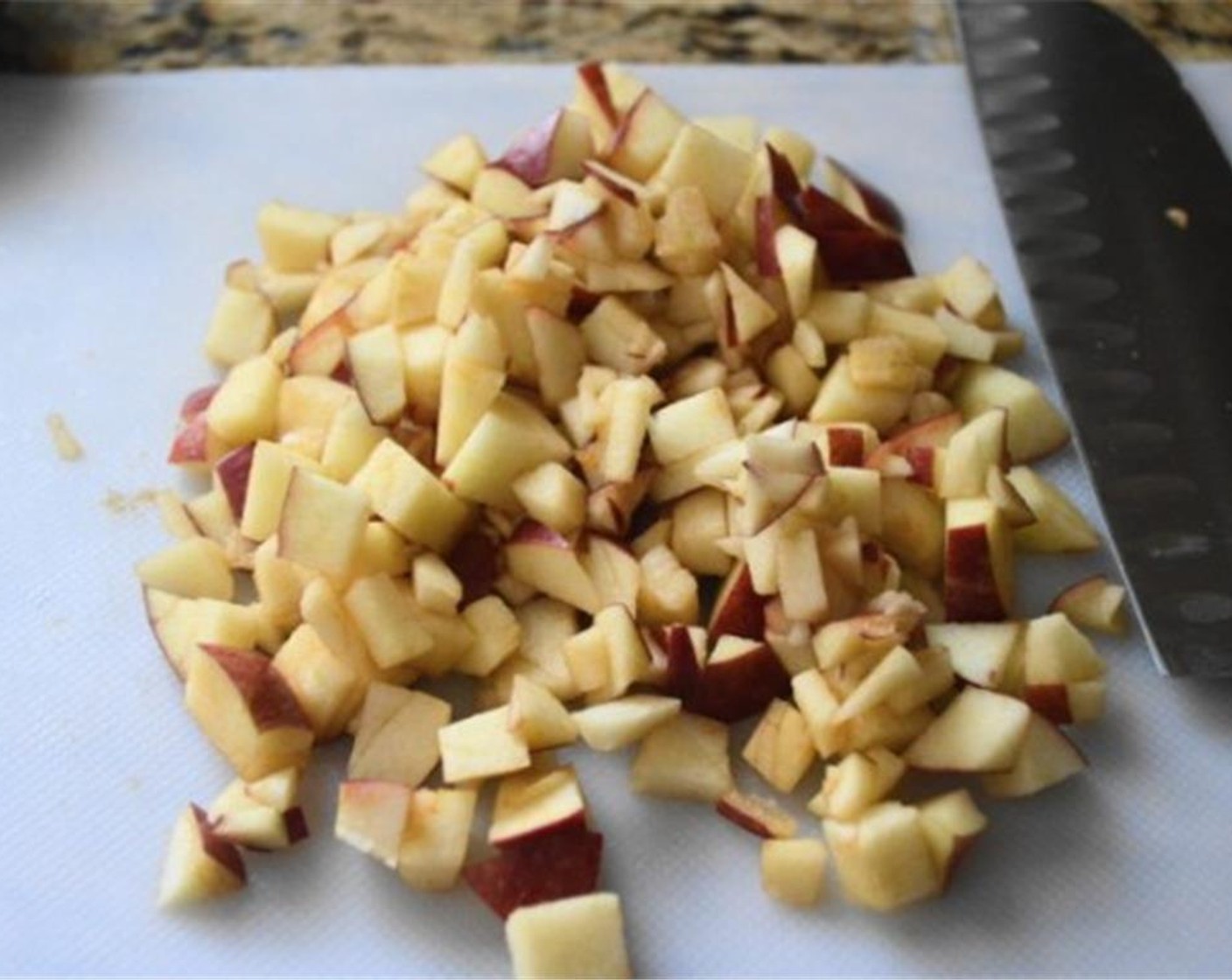 step 4 Switch to a rubber spatula and fold in the Apple (1). Set the batter aside and preheat your waffle iron.