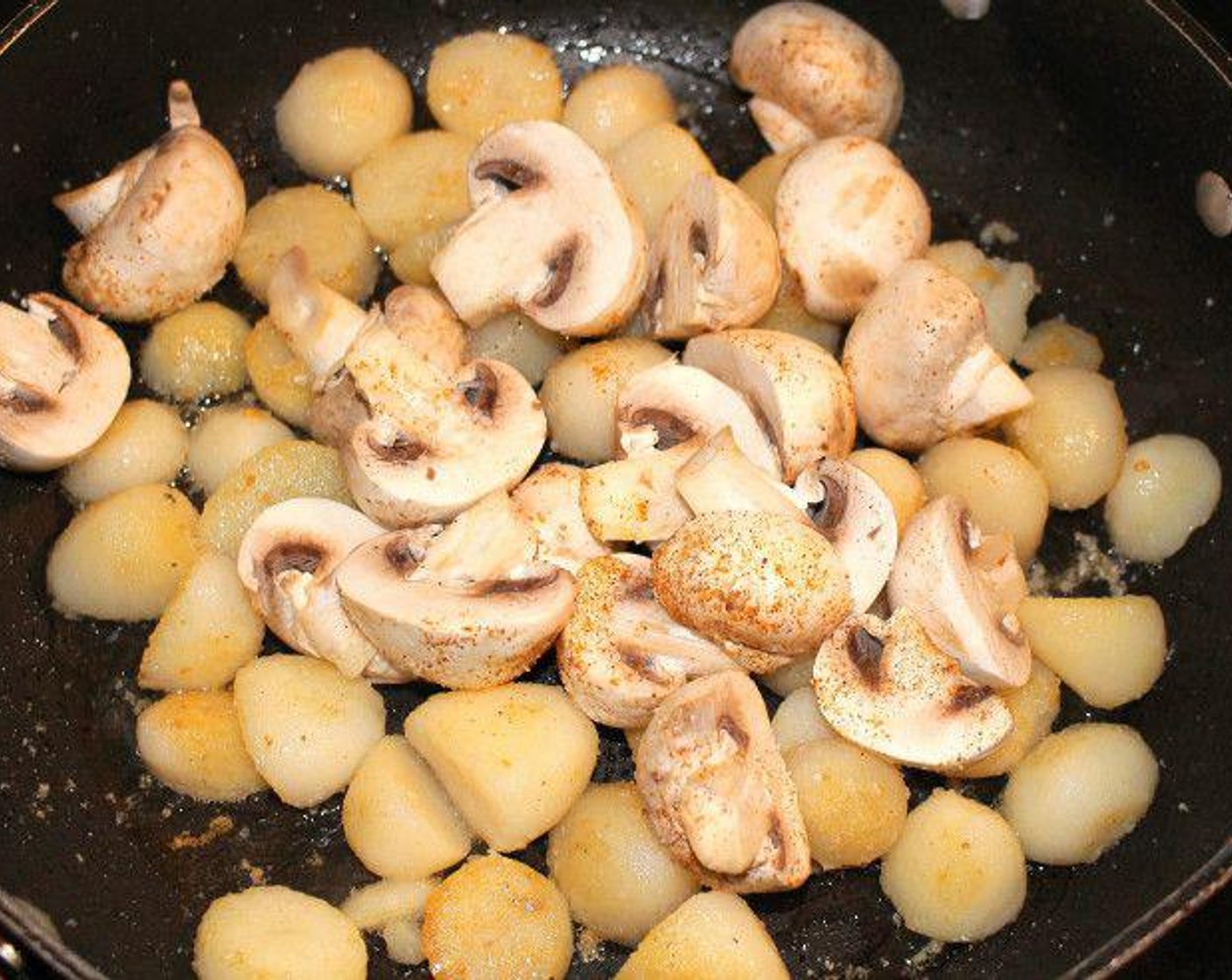 step 4 Add button mushrooms and satué with Salt (to taste) and Cayenne Pepper (to taste) until mushrooms are cooked through, about 2 minutes.