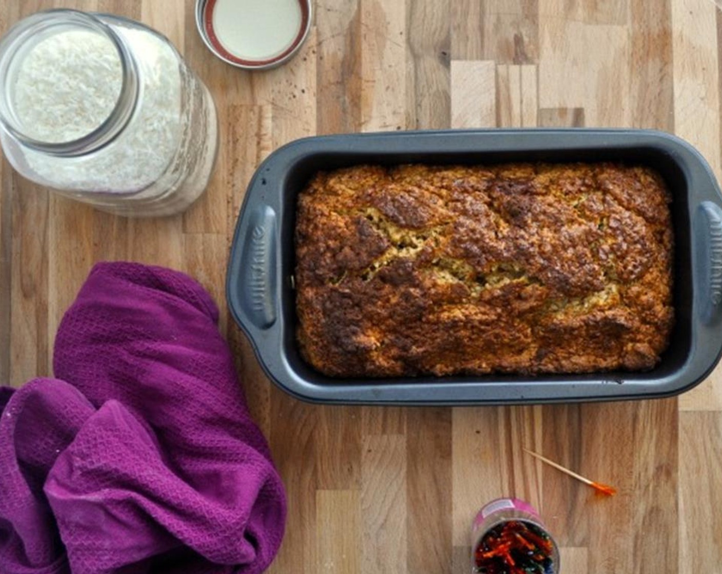 step 7 Add melted butter, mix until just incorporated. Pour into 9 x 5 loaf tin. Sprinkle with 1 Tbsp Coconut Sugar. Bake for about 1 hour, until golden brown and toothpick comes out clean.