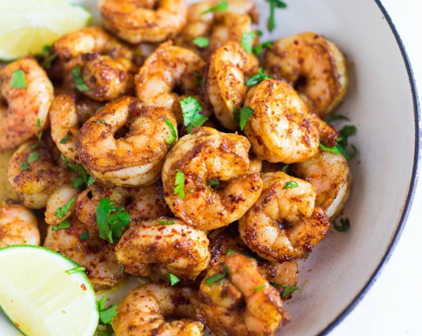 step 9 Grill the shrimp over medium high heat or pan sear on med-high in a well oiled cast-iron skillet, until just cooked. Over the shrimp, squeeze the Lime (1/2).