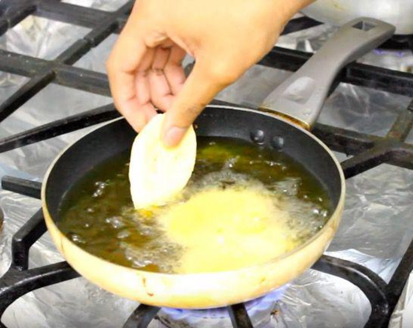 step 2 In a frying pan, warm Canola Oil (as needed) until it starts to bubble. Place plantains in the oil and cook for 30-45 seconds on each side, or until golden brown.