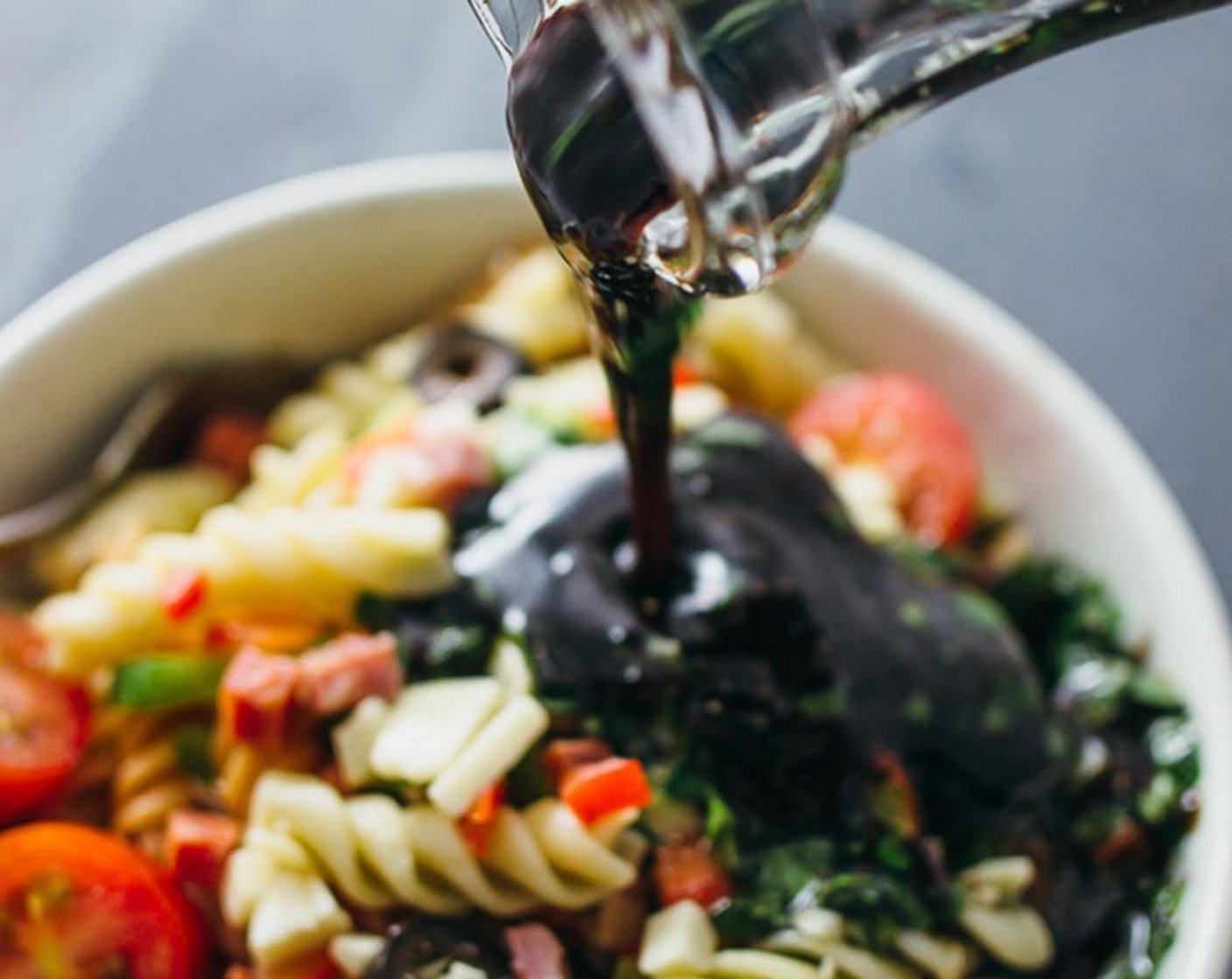 step 3 Mix the Dry Italian Salad Dressing Mix (2 1/2 Tbsp), Olive Oil (3/4 cup), Balsamic Vinegar (1/2 cup), Fresh Oregano (2 Tbsp), Salt (1/4 tsp) and Ground Black Pepper (1/4 tsp) in a small bowl, and pour into the large mixing bowl with the pasta salad.