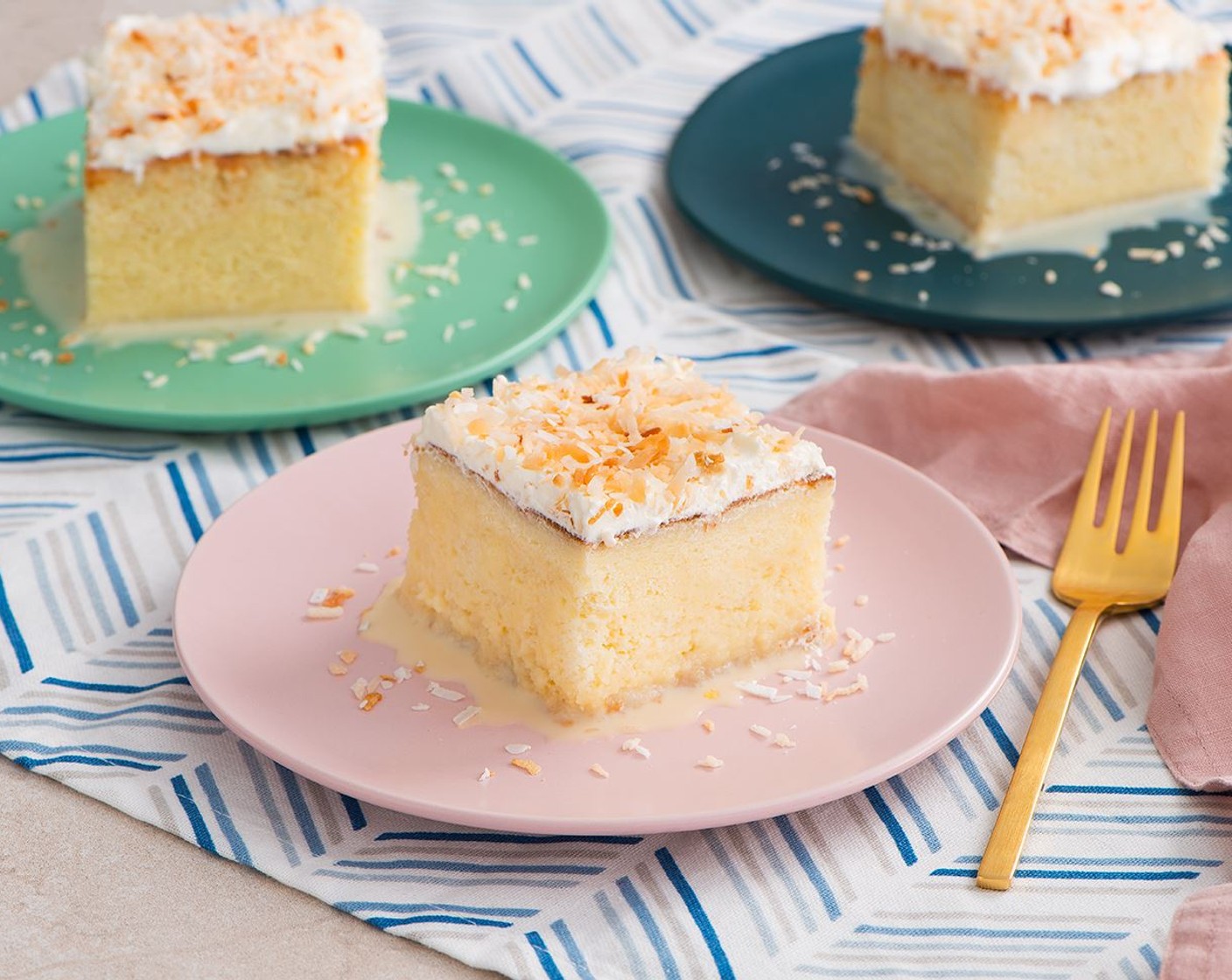 step 8 Invert cake onto serving platter. Peel off parchment paper. Spread whipped cream over top and sprinkle with Unsweetened Shredded Coconut (2/3 cup).