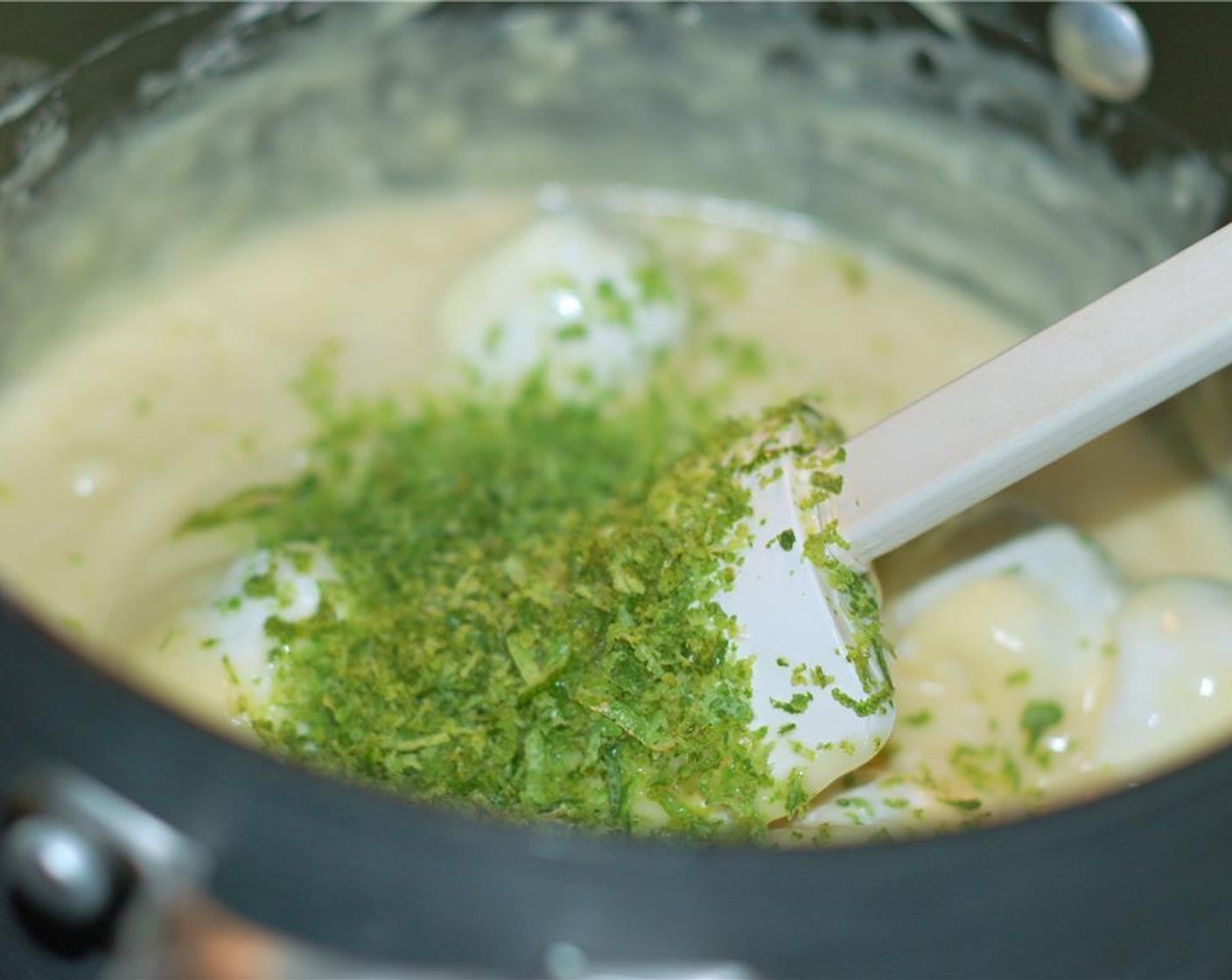 step 5 Remove from heat and stir in the lime zest, lime juice, Tequila (2 Tbsp), White Chocolate Chunks (2 1/2 cups), White Chocolate Chips (1/2 cup), and Large Marshmallows (12).