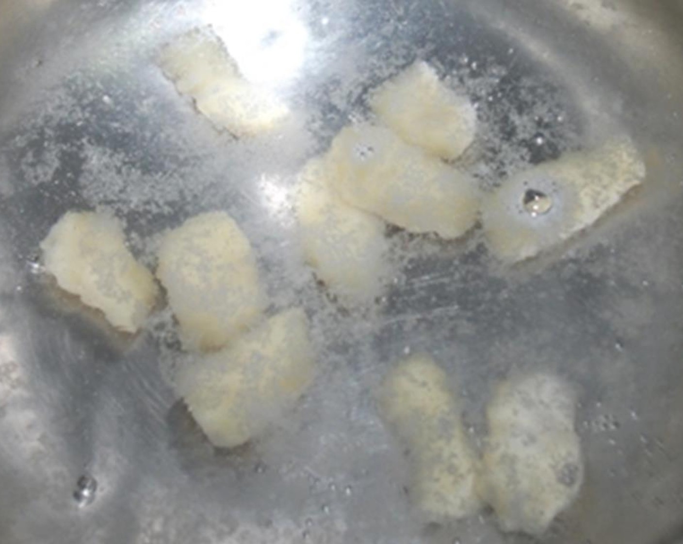 step 9 Gently drop in a few pieces of the gnocchi. Do not overcrowd the pan.