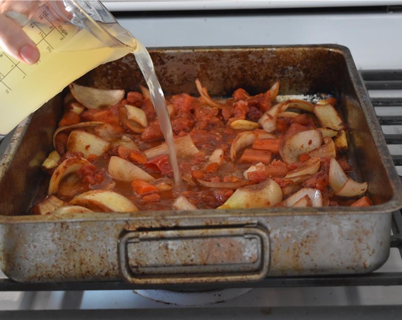 step 10 Stir in the Tomato Paste (1 Tbsp) and cook for 1 minute, then add the Canned Diced Tomatoes (395 g)  and Beef Broth (480 mL).