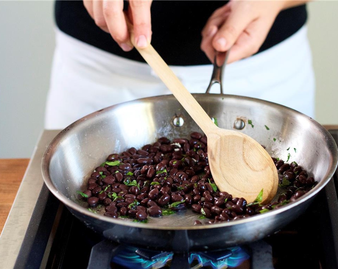 step 10 Add the drained and rinsed black beans, cook for one minute.