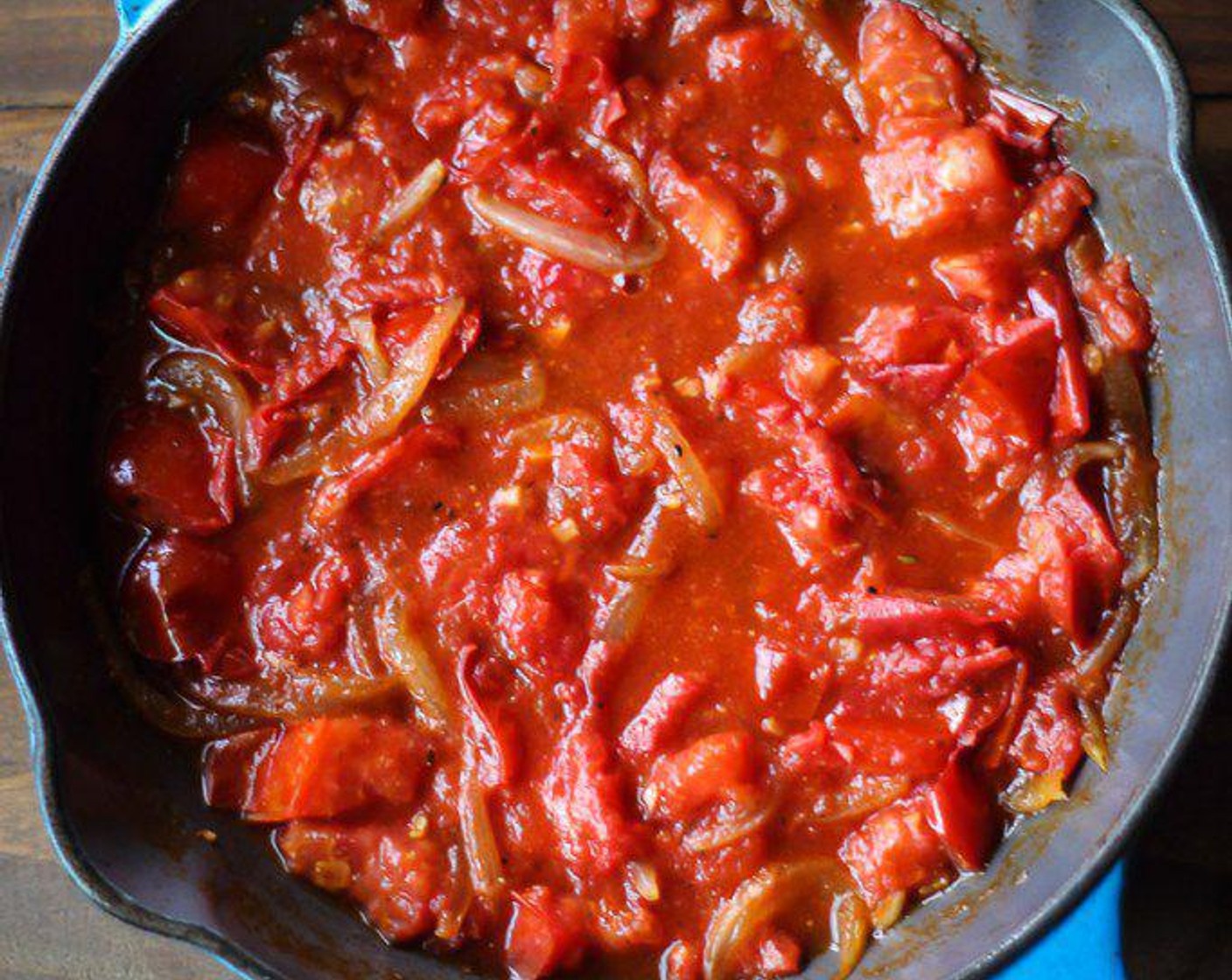 step 5 Gently stir tomato sauce and cook until some of the water has evaporated, about 3 minutes more.