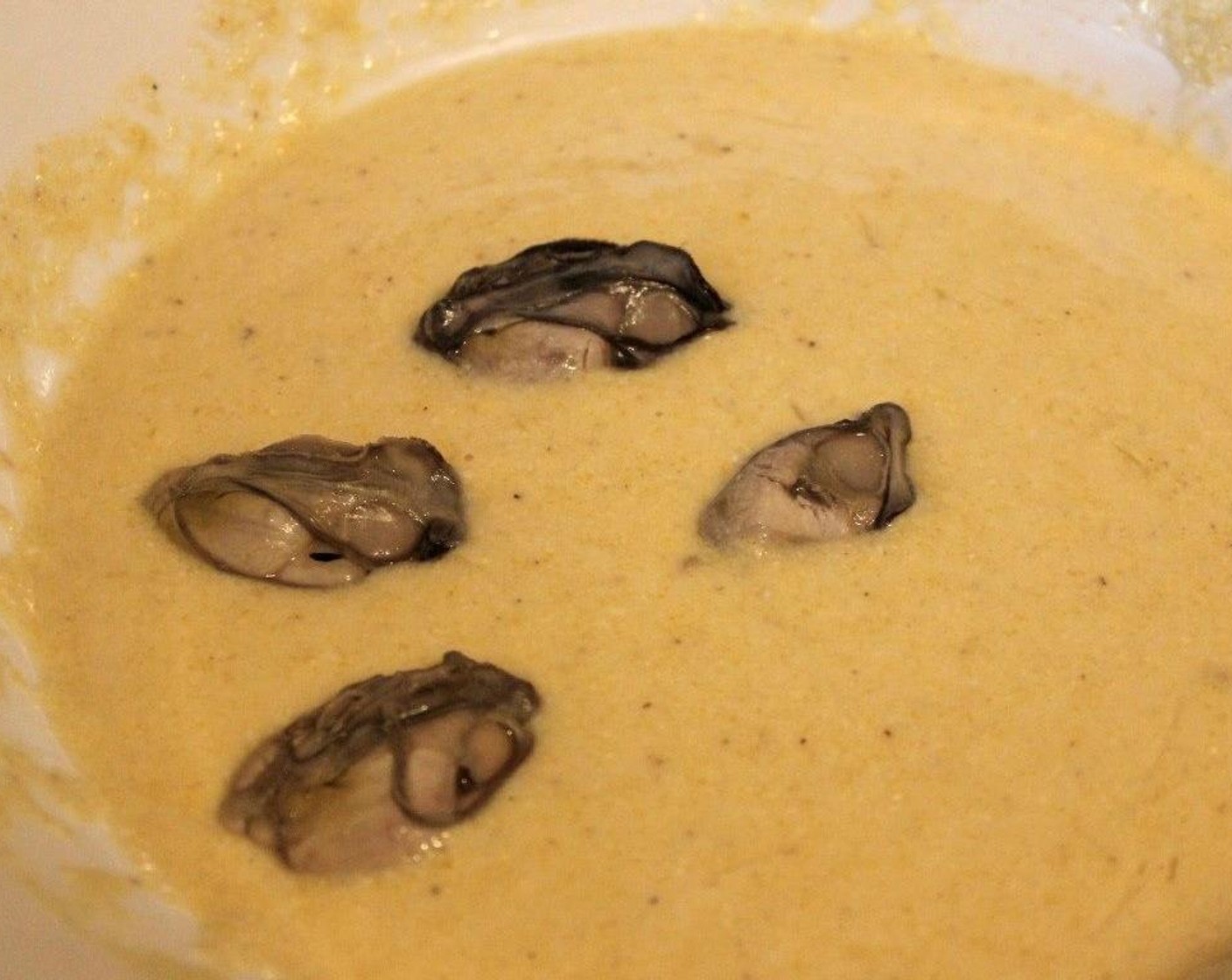step 5 Evenly coat the oysters in the batter and fry in batches of 4 to 6.