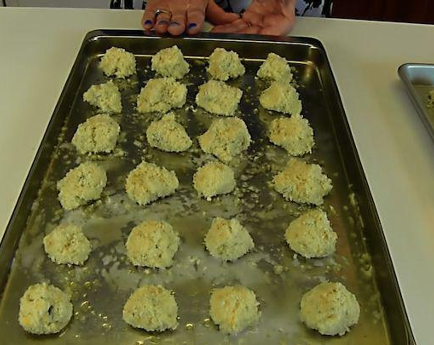 step 4 Bake in the preheated oven until brown on the bottom side. Then, use tongs to turn the tots over. Continue to bake until the other side is browned.