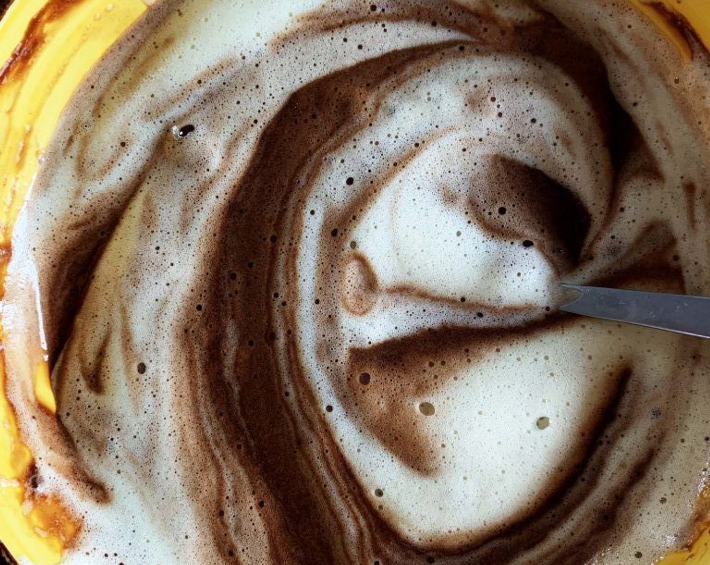 step 4 Gently fold the chocolate into the whipped eggs, adding the eggs slowly in 3-4 batches.