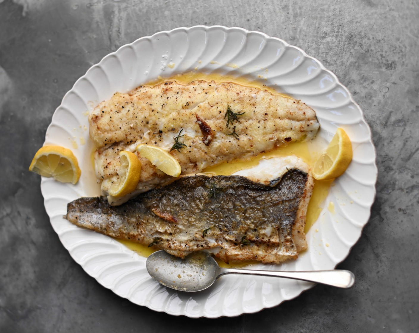 step 5 Transfer the hake to a warmed serving dish and serve immediately with extra lemon wedges and a green salad.