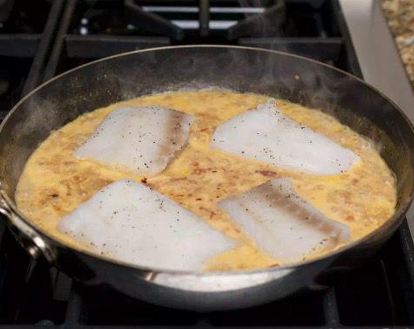 step 5 Pat Cod Fillets (4) dry with a paper towel and season generously on both sides with Salt (to taste) and Ground Black Pepper (to taste) (important!). Add to poaching liquid and simmer gently for approximately 3-4 minutes per side, being very careful not to overcook.